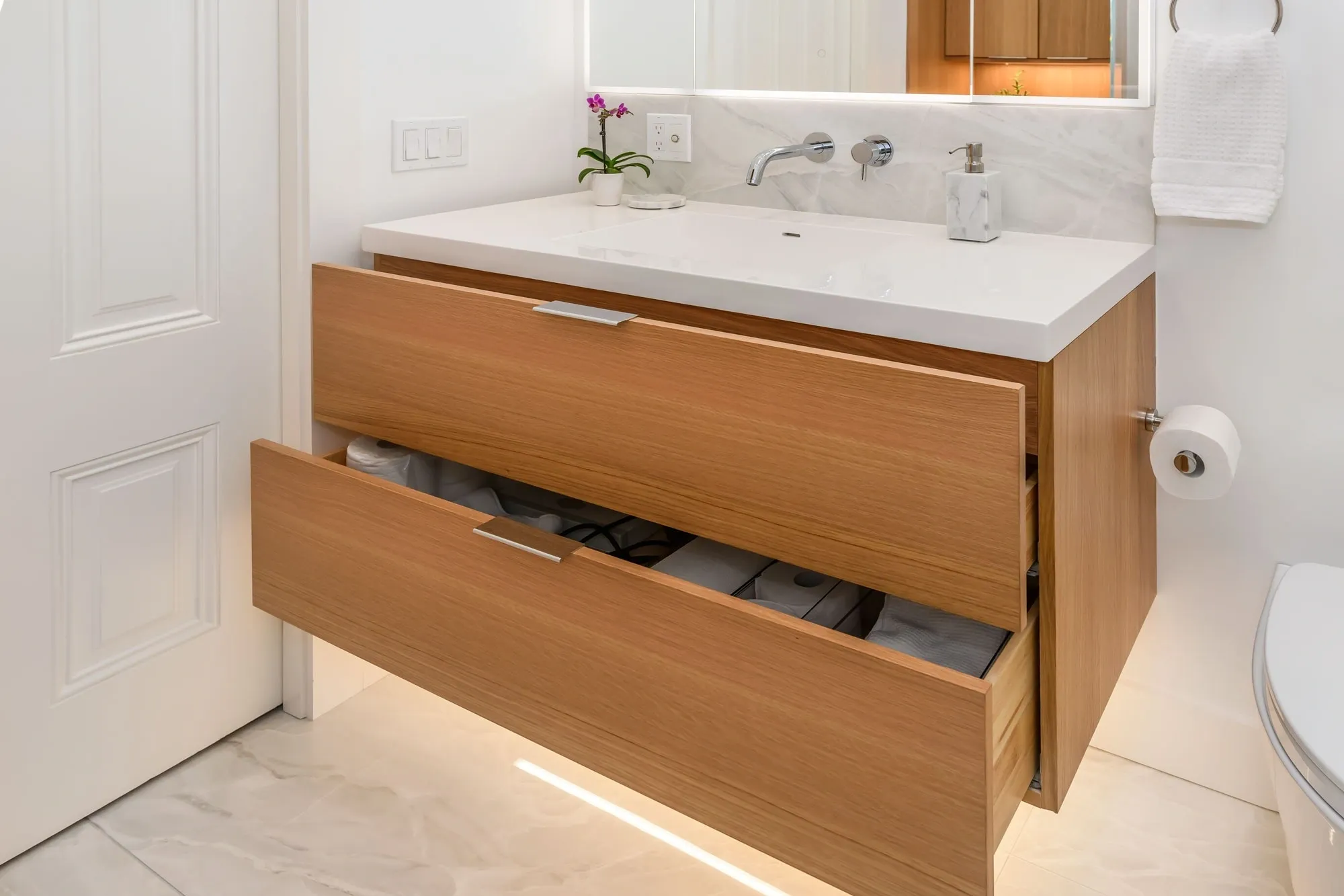 Modern bathroom vanity with open wooden drawers