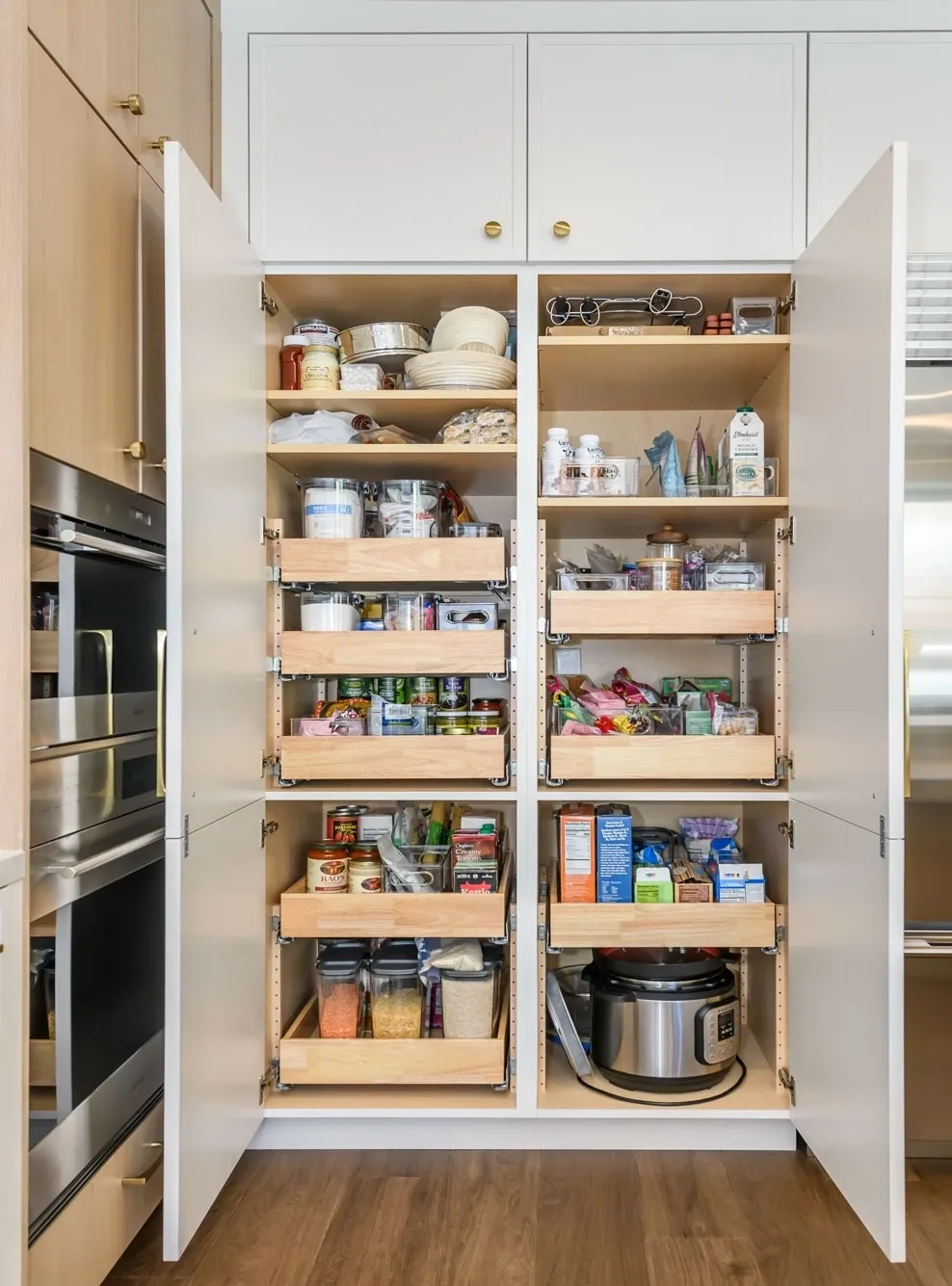 Organized kitchen pantry with pull-out shelves